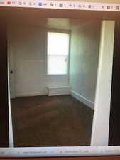 2nd floor living room Carpeted spare room featuring baseboards