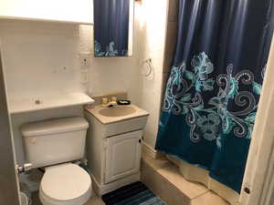 2nd floor Full bathroom with vanity, toilet, tile patterned floors, and curtained shower