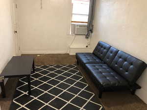 2nd floor Living area with carpet floors and cooling unit