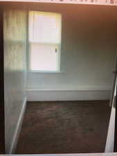 2nd floor bedroom View of carpeted empty room