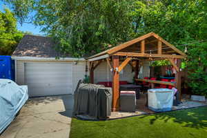 Detached garage featuring driveway