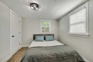 Bedroom with carpet flooring and baseboards