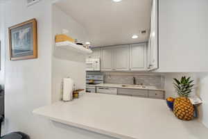 Kitchen dry bar conveniently located for entertaining.