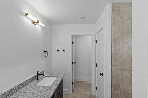 Full bath with vanity and water closet