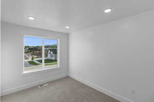 Bedroom 3 with recessed lighting, baseboards, and carpet floors