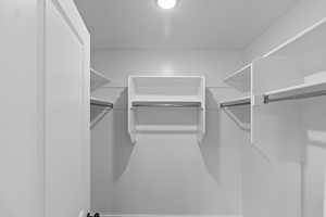 View of spacious primary closet