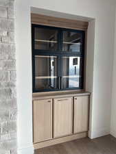 Detailed view of wood finished floors and baseboards