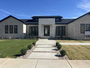 View of front of house featuring a front lawn