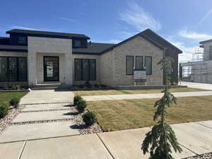 View of front of house with a front yard