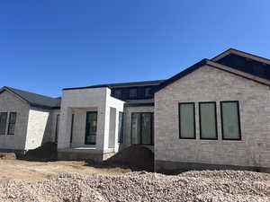 View of front of house with stone siding