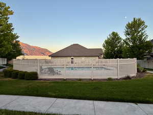 Pool at dusk with a mountain view
