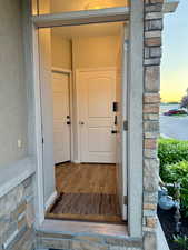 View of front door looking inside to both doors to both apartments