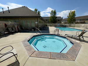 Community hot tub with a patio