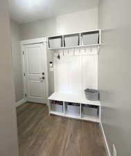 Mudroom featuring wood finished floors and baseboards