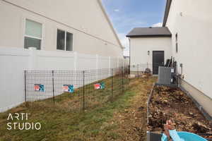 View of yard with central AC unit
