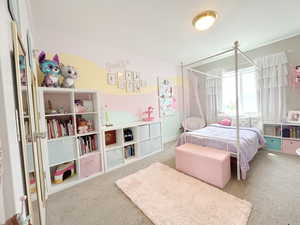 Carpeted bedroom featuring a textured ceiling