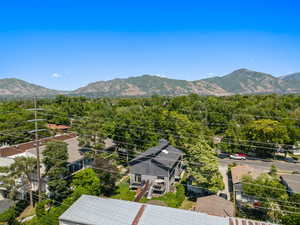 Drone / aerial view of mountains and a heavily wooded area