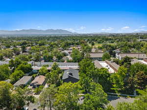 Aerial perspective of suburban area featuring a mountainous background