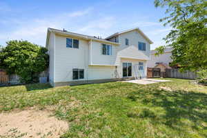 Back of house with a patio