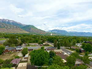 View of mountain background featuring nearby suburban area