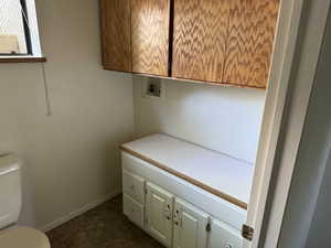 Laundry area featuring baseboards and hookup for a washing machine
