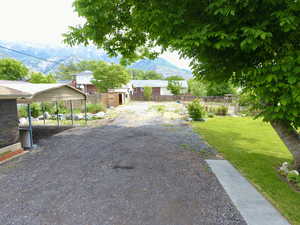 View of yard featuring a mountain view and a detached carport