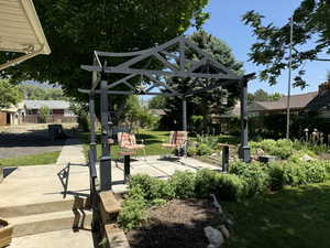 View of home's community featuring a gazebo, a patio area, and a yard