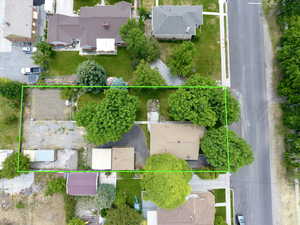 Aerial view of residential area with property parcel outlined