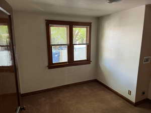 Spare room with carpet flooring and baseboards