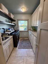 Laundry room with cabinet space, separate washer and dryer