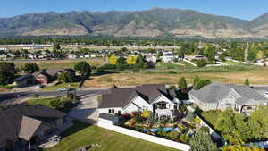 Aerial view of residential area featuring a mountain backdrop