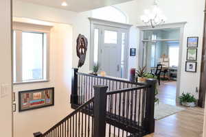 large open Foyer with railing toward basement
