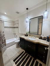 Main Hall Bathroom featuring crown molding, shower / bathtub combination, and tile patterned floors