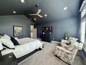 Bedroom with carpet, lofted ceiling, recessed lighting, ceiling fan, and baseboards