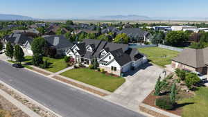 Aerial perspective of suburban area featuring a mountain backdrop