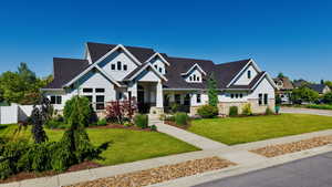 Craftsman inspired home featuring stone siding, covered porch, with view of the mountians