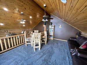 Carpeted dining space with wood ceiling, ceiling fan, lofted ceiling, baseboards, and recessed lighting