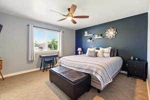 Bedroom featuring carpet floors, a ceiling fan, and baseboards