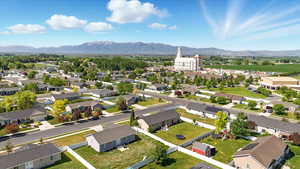 Aerial perspective of suburban area featuring a mountainous background