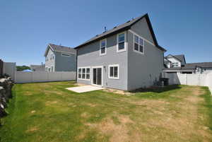 Back of property featuring a patio, stucco siding, and central air condition unit