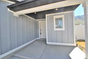 Front Porch featuring board and batten siding and mountain view and community view.