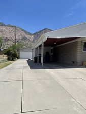 View of property exterior featuring a mountain view