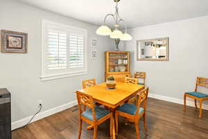 Dining room with baseboards and wood finished floors