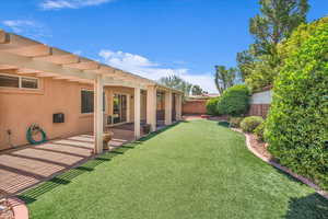 View of yard featuring a pergola and a patio area