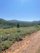 View of mountain background featuring rural landscape
