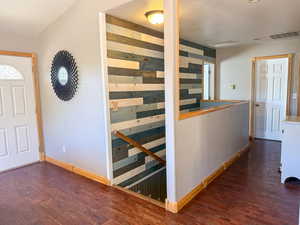 Entrance foyer with wood finished floors and baseboards