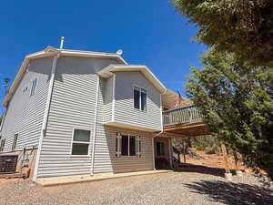 Rear view of house with a deck