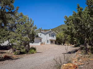 View of property hidden behind natural elements
