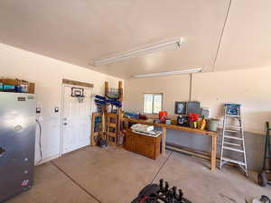 Garage with freestanding refrigerator