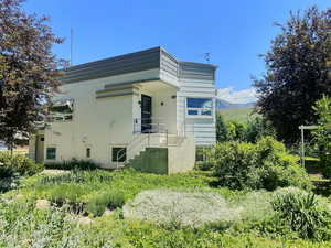 View of property exterior with stairs
